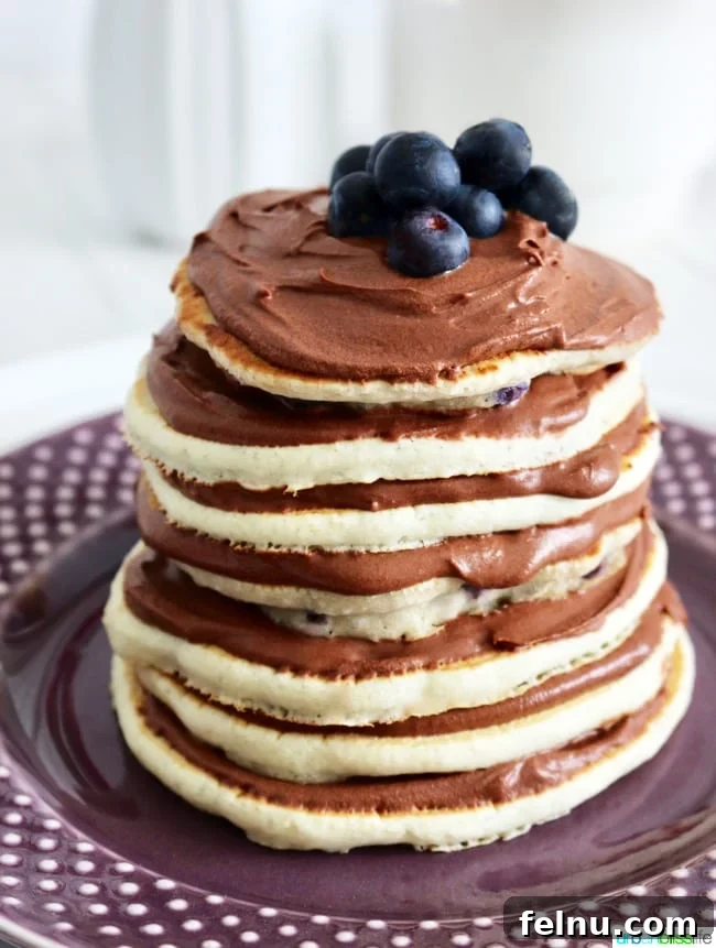 Rich Chocolate Pancake Towers with Pillowy Frosting 9 Pancake Cake Stacks with Dairy-Free Chocolate Frosting recipe on UrbanBlissLife.com