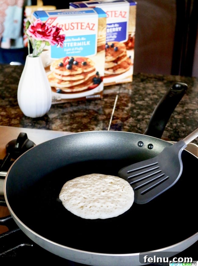 Rich Chocolate Pancake Towers with Pillowy Frosting 3 pancake in pan