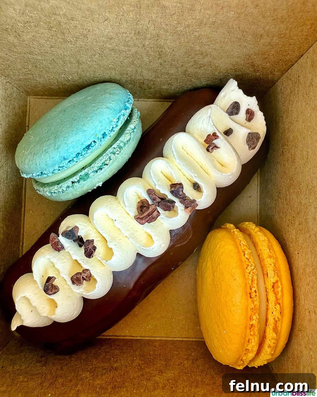 Hood River: Oregon's Adventure Capital 16 An exquisite display of colorful macarons and a delectable éclair, showcasing the sweet treats available.