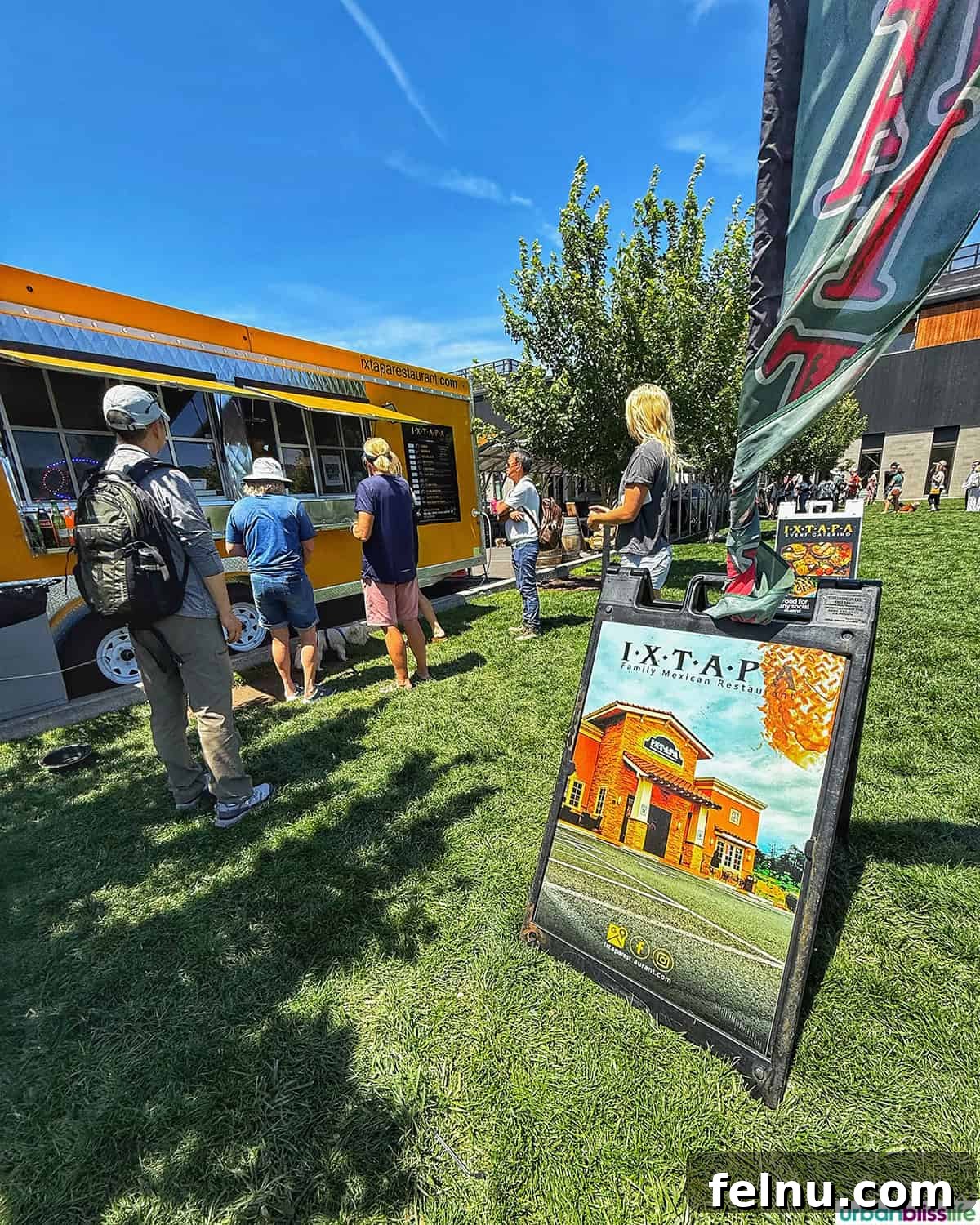 Hood River: Oregon's Adventure Capital 6 A bustling scene of outdoor food trucks with lines of eager customers at the Hood River waterfront, signifying a popular culinary spot.