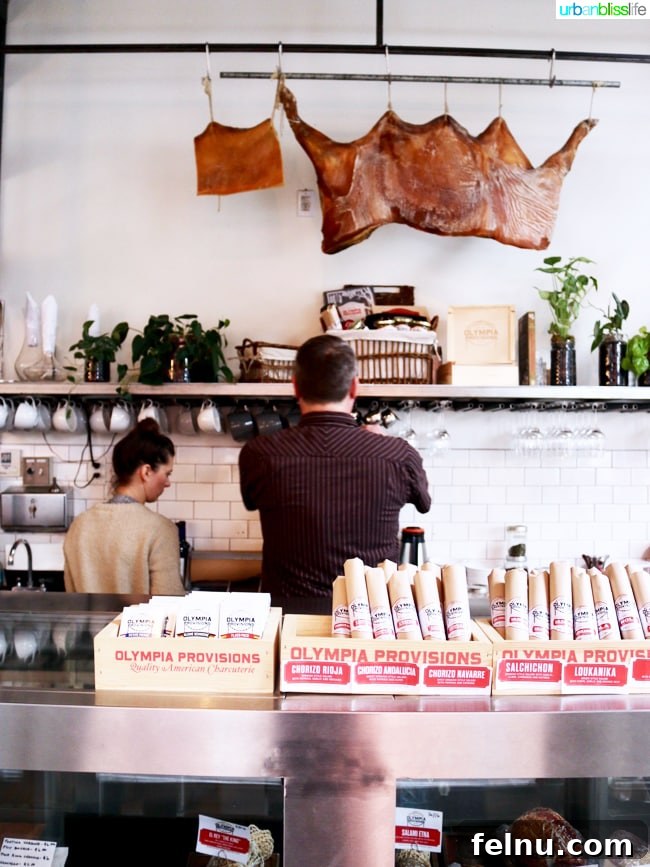 Olympia Provisions Unveils Handcrafted Landrauchschinken 2 Olympia Provisions counter showcasing a variety of handcrafted meats, Portland, Oregon