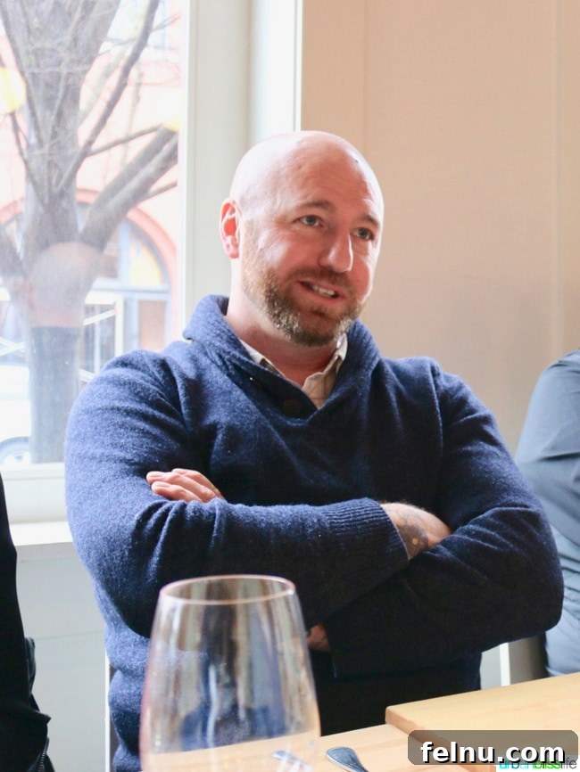 Olympia Provisions Unveils Handcrafted Landrauchschinken 3 Elias Cairo, Head Salumist and Co-Owner of Olympia Provisions, standing proudly with his charcuterie products