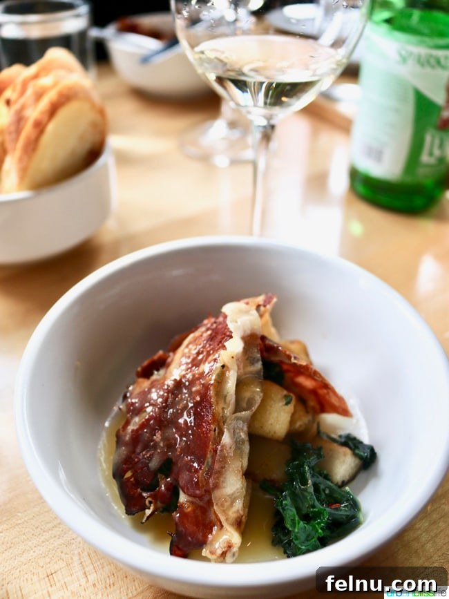 Olympia Provisions Unveils Handcrafted Landrauchschinken 6 Gourmet Landrauchschinken dumplings served with seared pear, kale sprouts, and orange butter