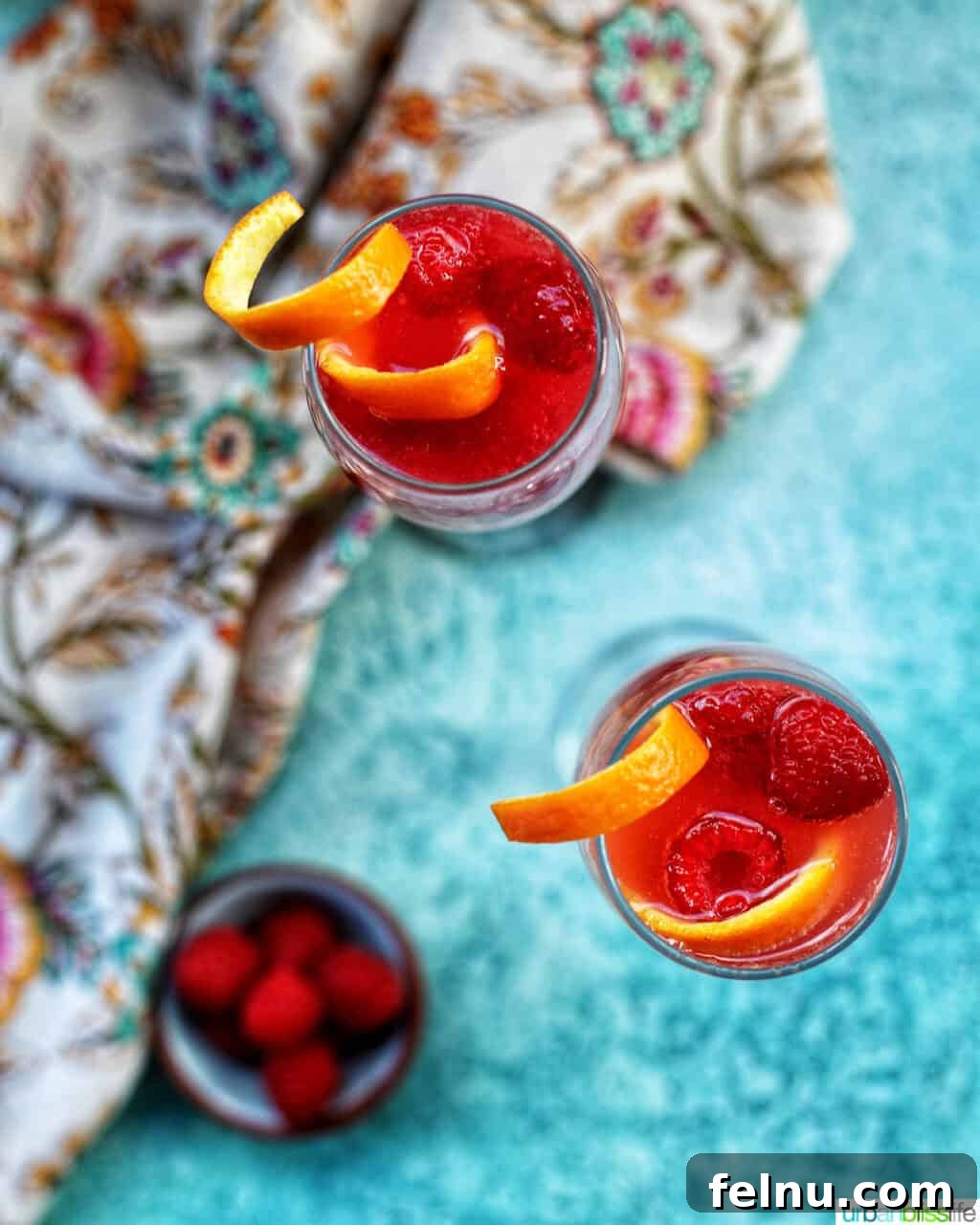 Vibrant Sips: Fruity Cocktail Recipes to Welcome Spring & Summer 3 Fruity cocktail recipes - overhead photo of two Raspberry Mimosas