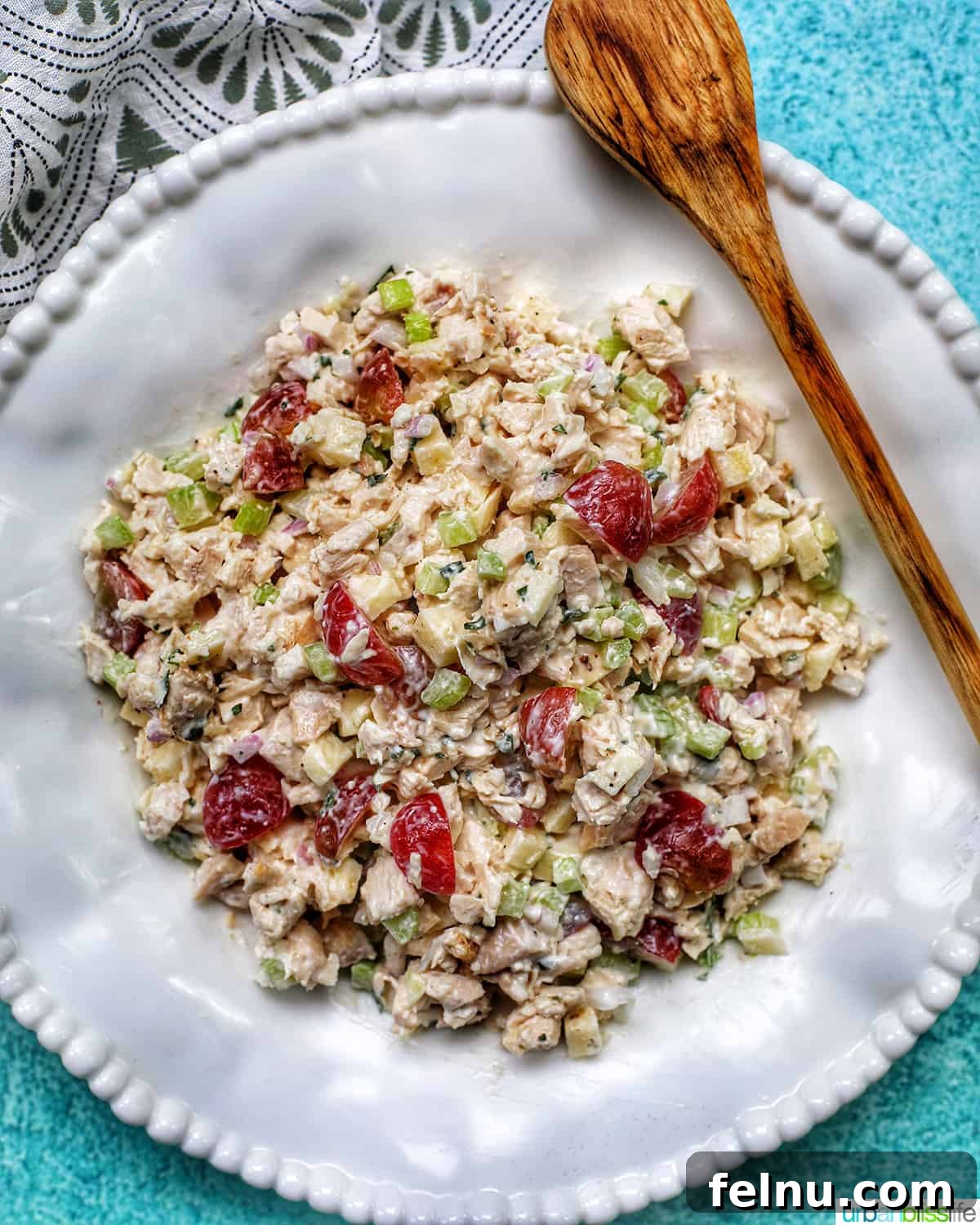 Dainty Chicken Salad Tea Bites 3 Freshly made chicken salad in a bowl with a spoon