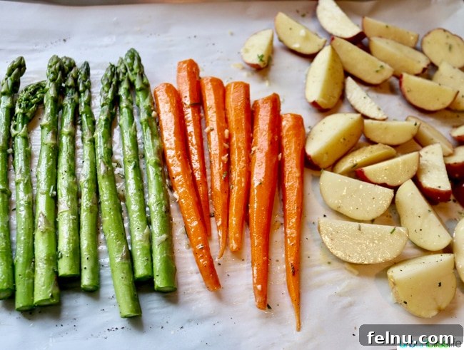 Classic Lemon Herb Roasted Chicken and Veggies 12 A close up of roasted vegetables coated in Herb Butter