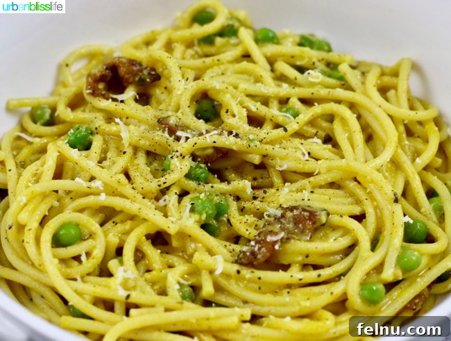 Golden Turmeric Pasta with Smoky Bacon and Sweet Peas 8 Pasta with Turmeric, Bacon, and Peas is a hearty lunch or dinner dish full of flavor!