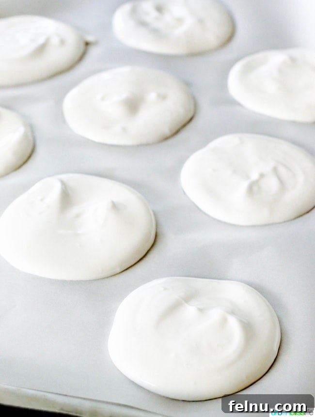 Mini Pavlovas with Summer Fruits and Whipped Cream 6 Meringues on Baking Sheet