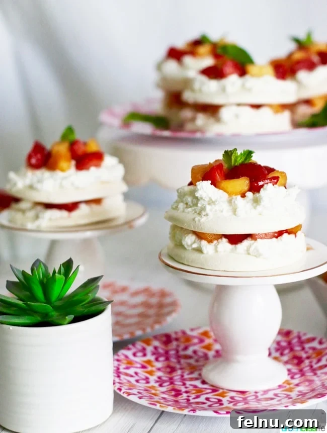 Mini Pavlovas with Summer Fruits and Whipped Cream 7 Pavlova Mini Cakes on Pedestal