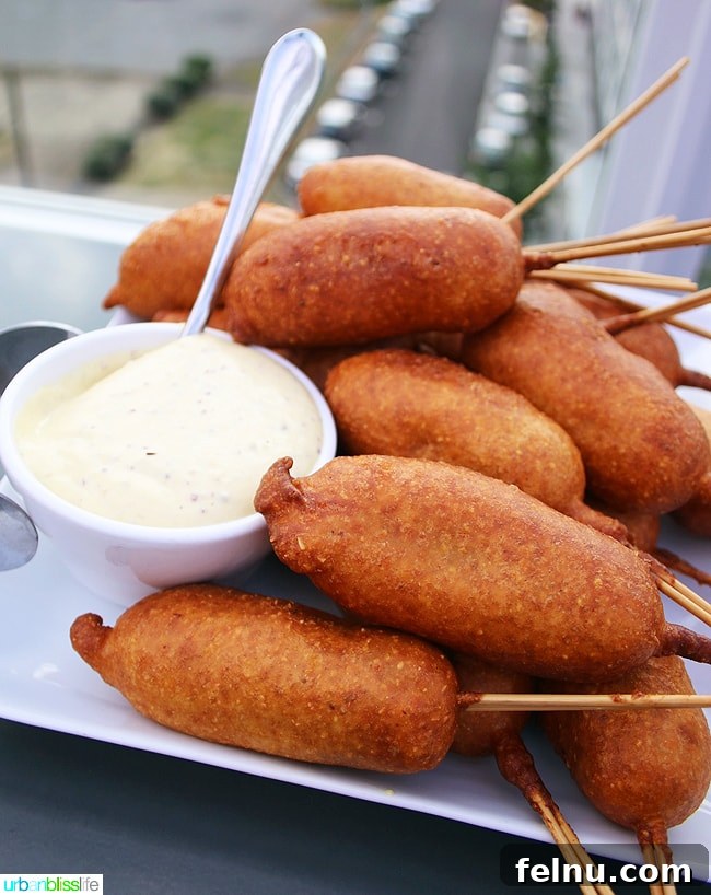 Altabira: Portland's Former Rooftop Restaurant 12 Gourmet Kobe Beef Corn Dogs with Sauce Dijonnaise, a delightful happy hour bite at Altabira Portland