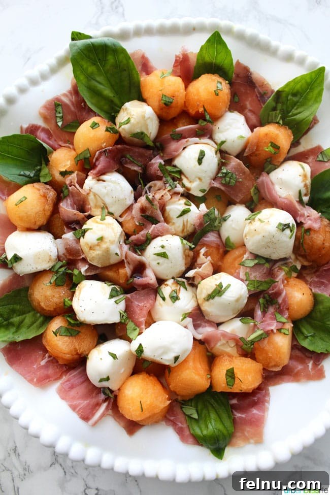 Creamy Tomato Flatbread Pizza Delight 8 Refreshing Summer Melon & Prosciutto Caprese Salad, a sweet and savory combination for warm weather.