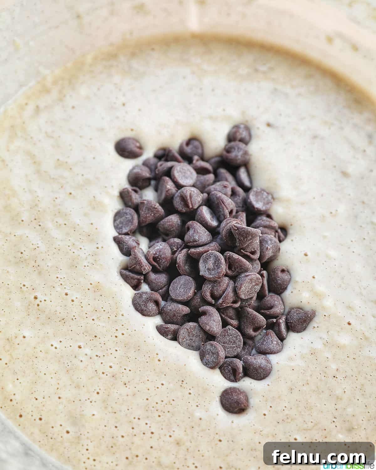 Effortless Chocolate Chunk Banana Bread 9 Gently folding chocolate chips into the banana bread batter.