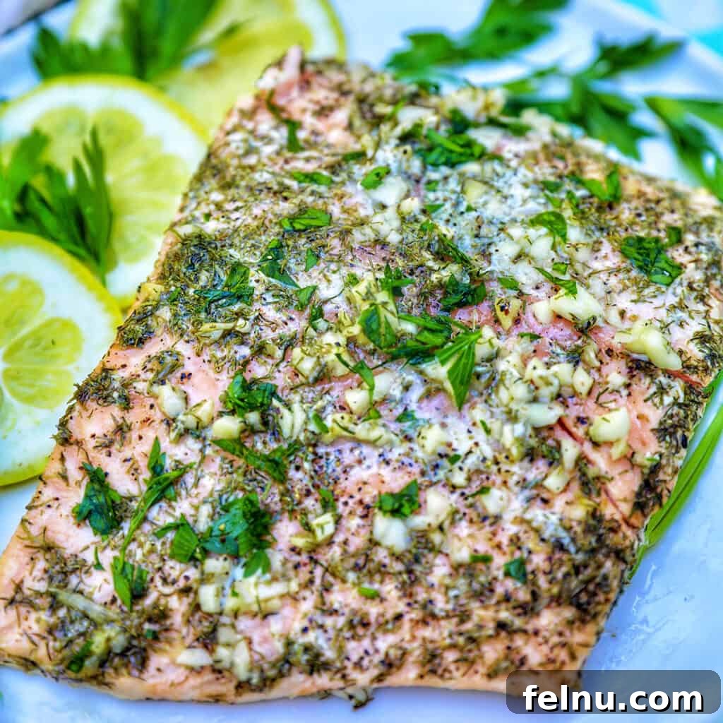Zesty Lemon Herb Salmon Delight 3 Grilled salmon with lemon slices, garlic, and herbs.