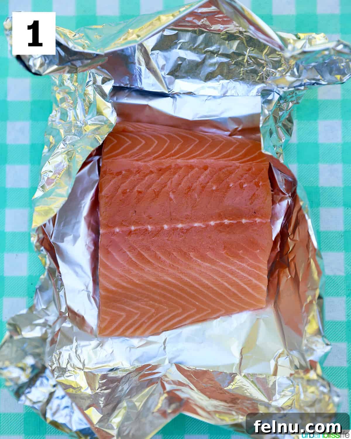 Zesty Lemon Herb Salmon Delight 5 Salmon filet placed in aluminum foil.