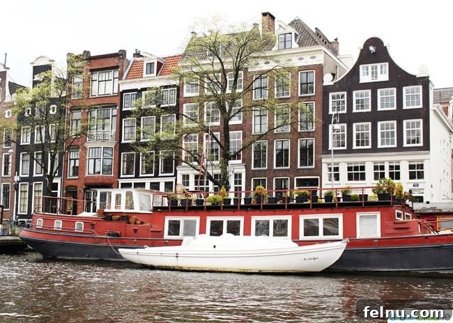 Silverton's Botanical Gem: The Oregon Garden 27 A vibrant red canal boat navigating the historic canals of Amsterdam.