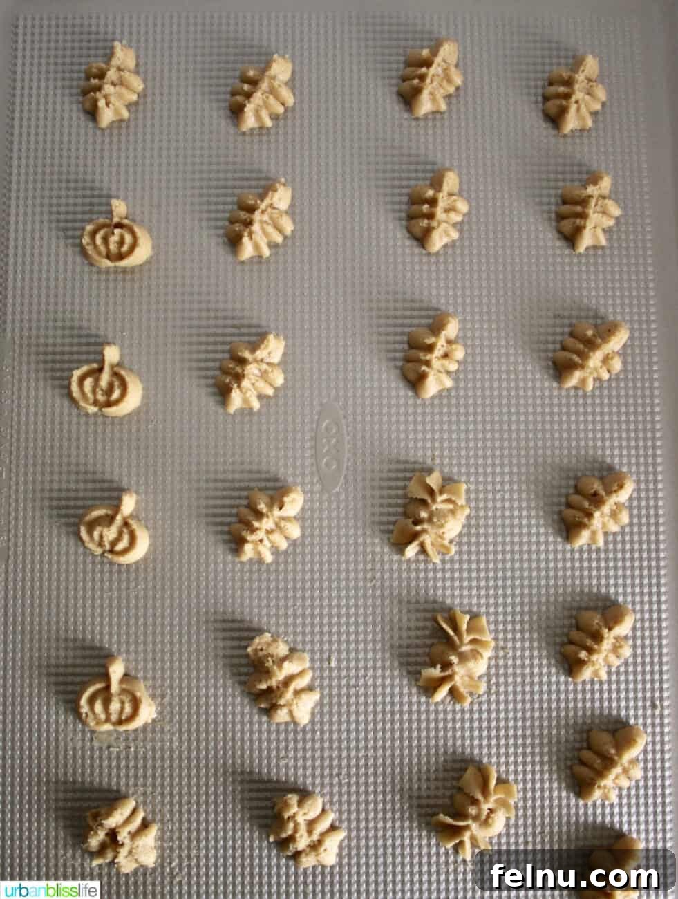 Maple Cinnamon Spritz Delights 7 Spritz Cookie dough on a baking sheet