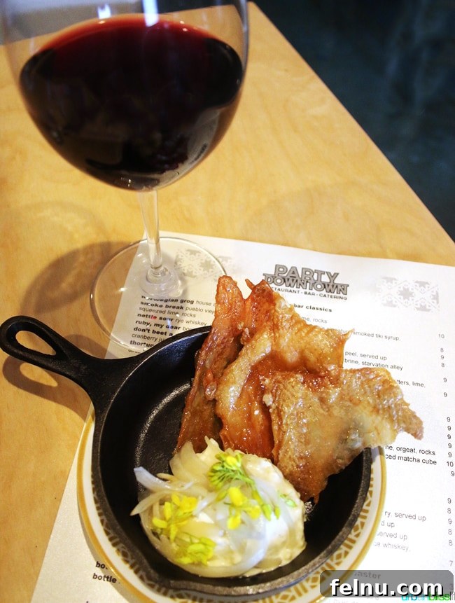 Party Downtown: Eugene, Oregon's Must-Visit for Exceptional Dining and Catering 4 Red wine glass at Party Downtown, a top restaurant in Eugene, Oregon. Food Travel Bliss on UrbanBlissLife.com