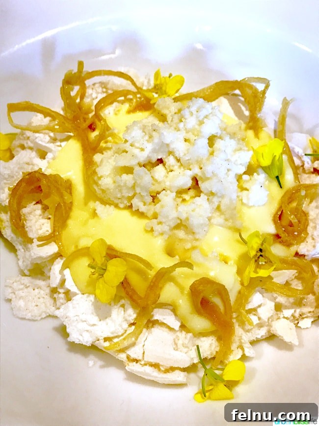 Party Downtown: Eugene, Oregon's Must-Visit for Exceptional Dining and Catering 8 Light and refreshing Pavlova meringue dessert with lemon curd at Party Downtown, a top restaurant in Eugene. Places to eat in Eugene.