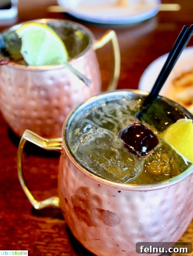 Line and Lure Fresh Catch & Craft Brews 7 Black Cherry Mule cocktail at Line and Lure restaurant with lime and mint garnish