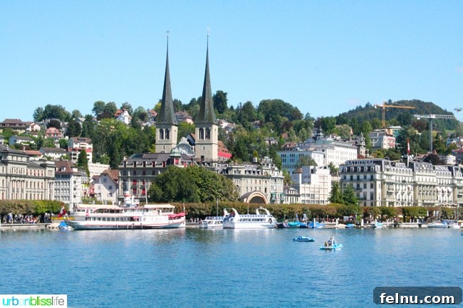 Lucerne Family Fun: Top Activities with Kids 6 A scenic riverfront walk in Lucerne, offering stunning views of the Reuss River and the surrounding mountains.