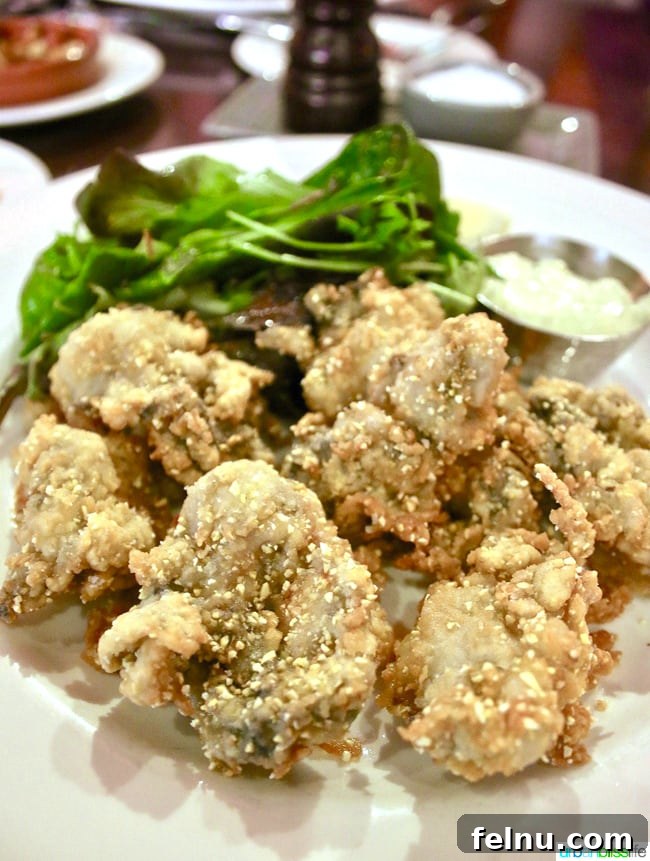 Marche Restaurant: A Taste of France in the Pacific Northwest 9 Cornmeal Fried Willapa Bay Oysters at Marché restaurant in Eugene, Oregon, a delightful and indulgent lunch option.