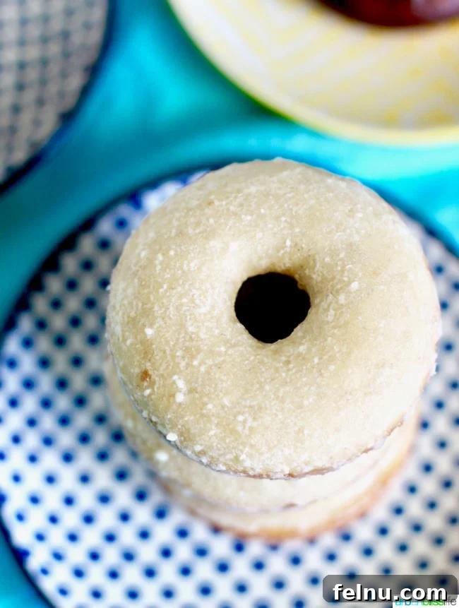 Vanilla glazed donuts, showing off their smooth and creamy texture.