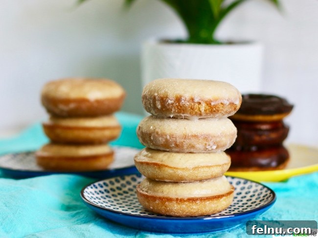 Baked Cinnamon Sugar Donuts with all three glazes stacked together, showcasing the variety and deliciousness.