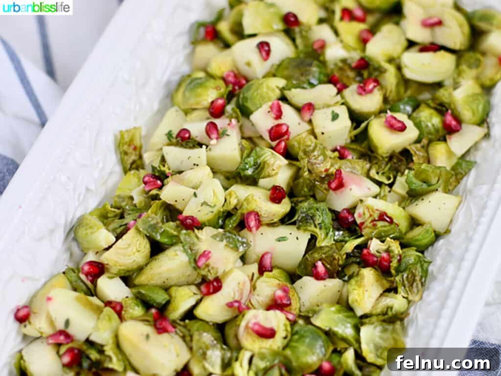 Roasted Brussels sprouts and apples on a baking sheet