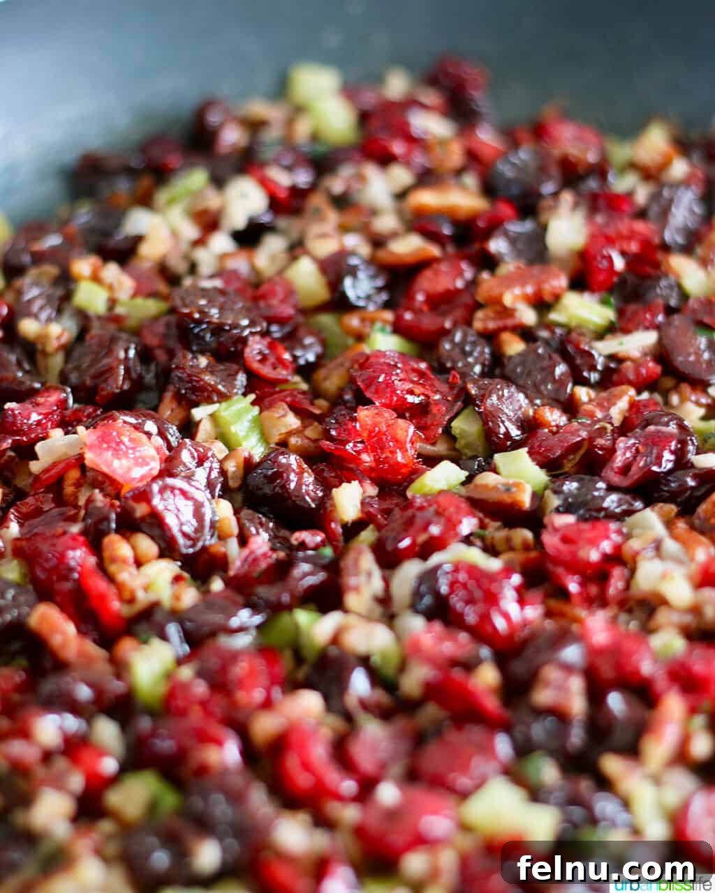 A Festive Harvest Stuffing 5 Cranberry stuffing with wild rice, cherries, and pecans toasting in a skillet