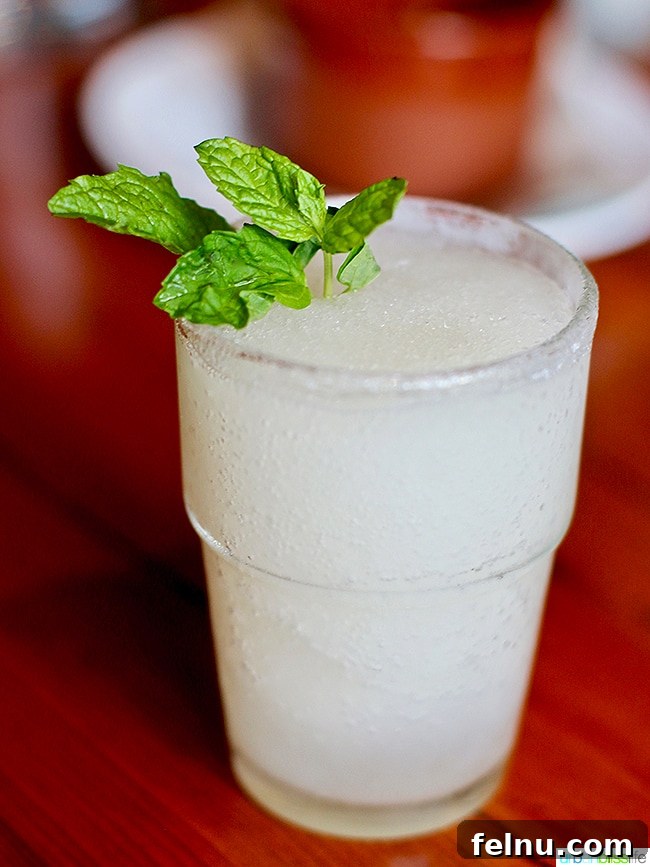 Cocktail at Ray Restaurant, Portland, Oregon - Ginger Lemonana Slushy with Prosecco.