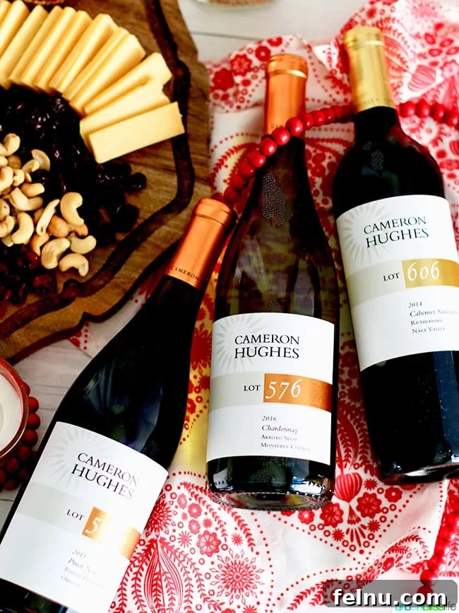 Uncorking Holiday Joy: The Art of Wine Pairing Parties 5 Flat lay of three Cameron Hughes wine bottles and glasses. UrbanBlissLife.com