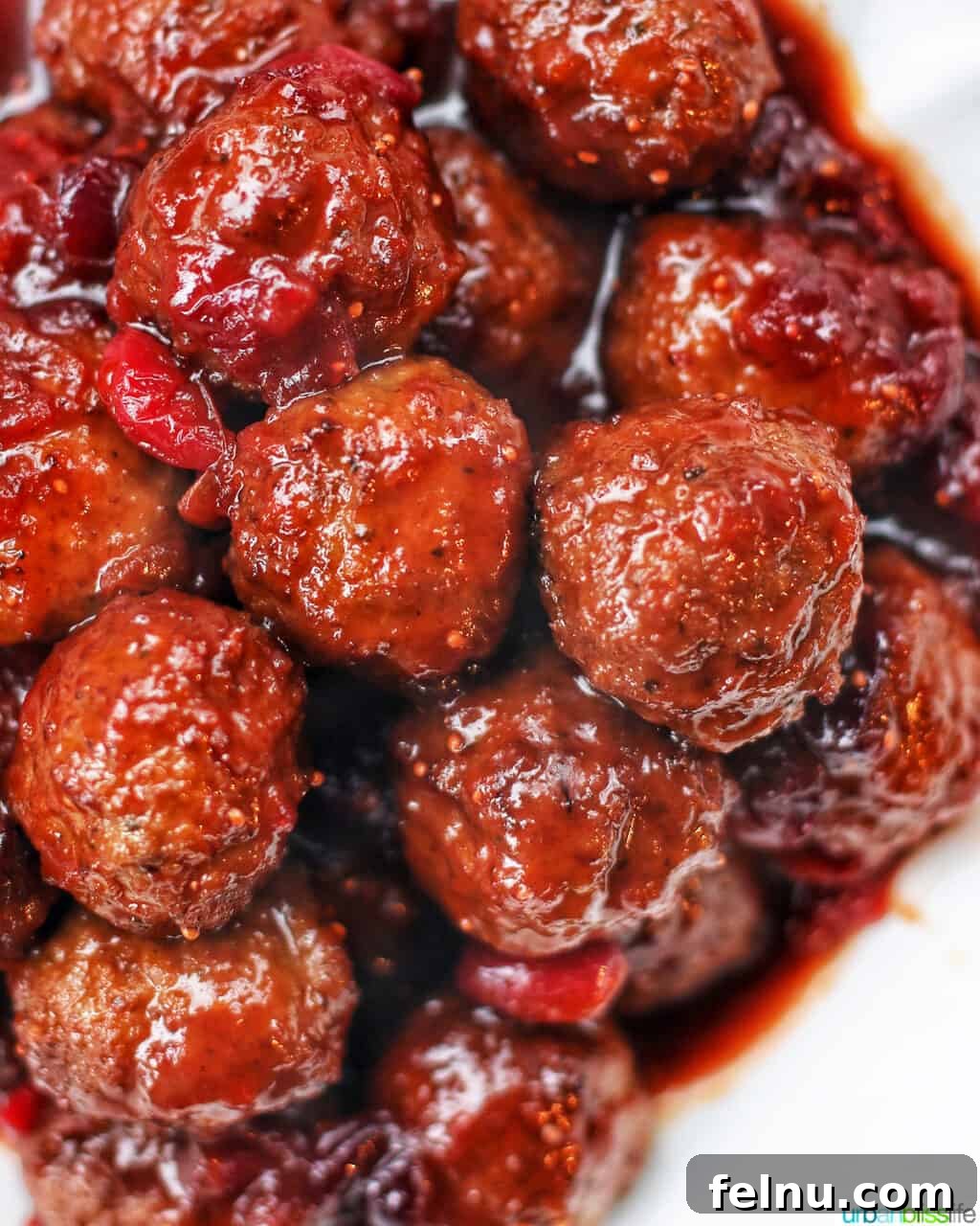 Sweet and Tangy Cranberry Glazed Meatballs 11 closeup of cranberry meatballs in a serving bowl