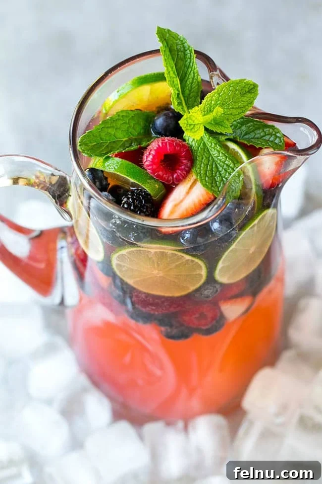 Festive Winter Sips: 20 Cocktail Recipes for Your Holiday Gathering 11 Sparkling Champagne Punch for a festive winter holiday party.