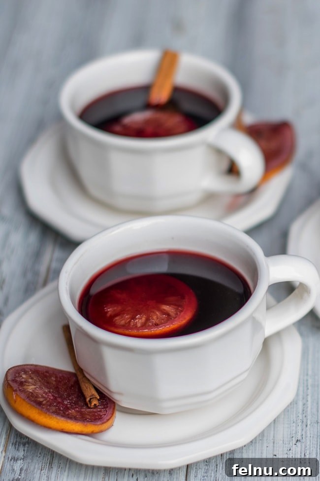 Festive Winter Sips: 20 Cocktail Recipes for Your Holiday Gathering 13 Warm Mulled Wine for a Crowd, a comforting winter holiday drink.