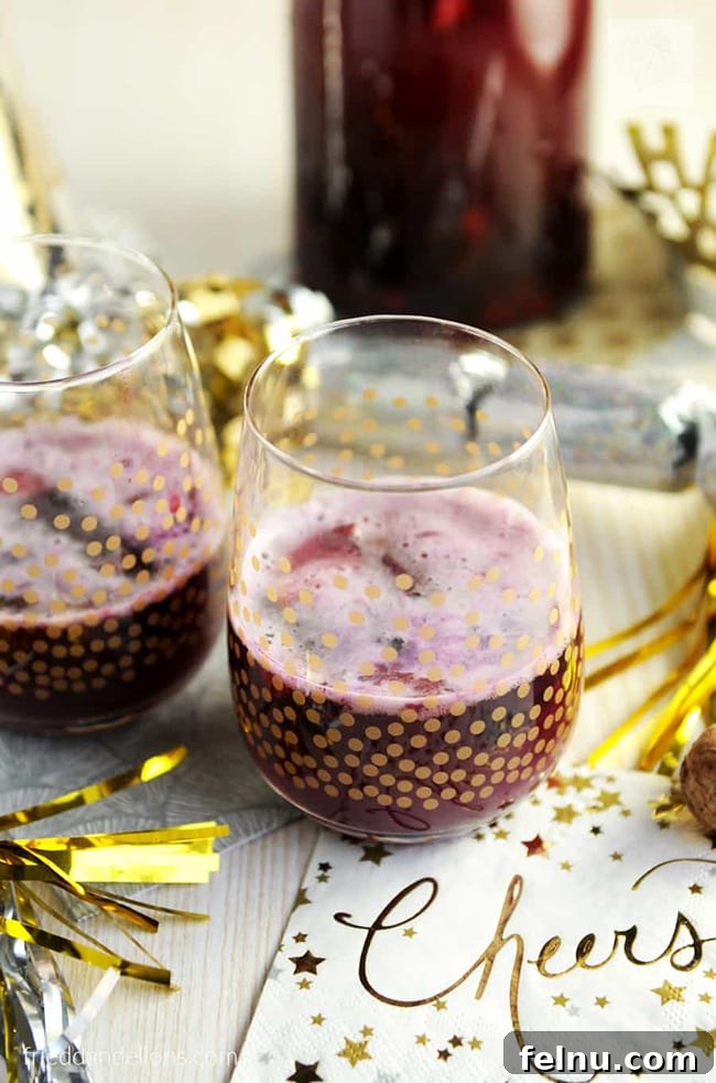 Festive Winter Sips: 20 Cocktail Recipes for Your Holiday Gathering 19 Festive Champagne Sangria with pineapple and berries for a New Year's celebration.