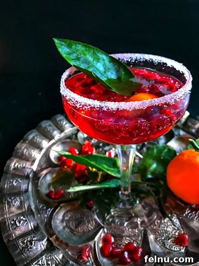 Festive Winter Sips: 20 Cocktail Recipes for Your Holiday Gathering 20 Ruby red Pomegranate New Year's Punch with rum and vodka.