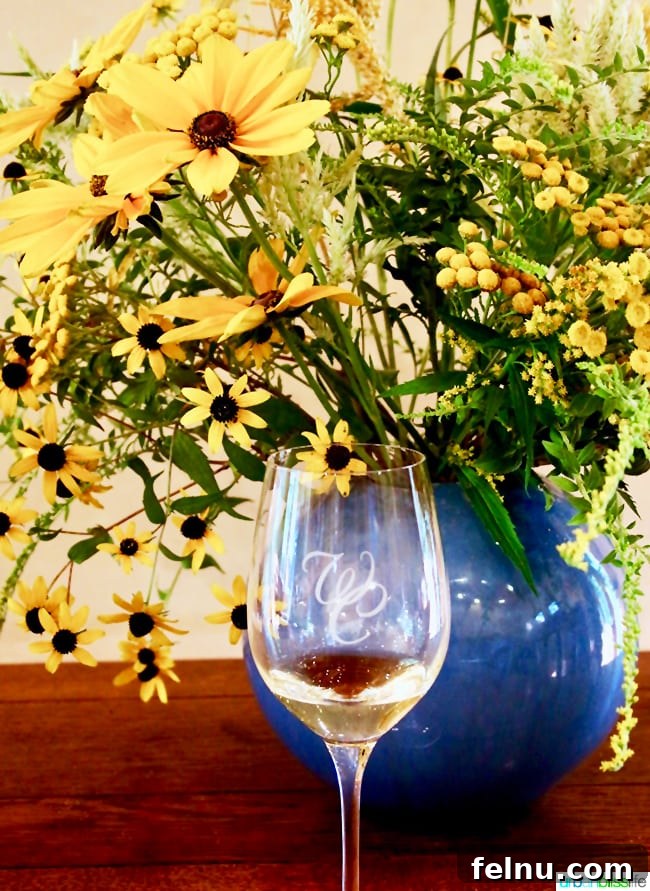 Wooldridge Creek: A Taste of Oregon's Applegate Valley 7 A bottle of Wooldridge Creek Winery wine beautifully displayed alongside vibrant flowers in Grants Pass, Oregon.