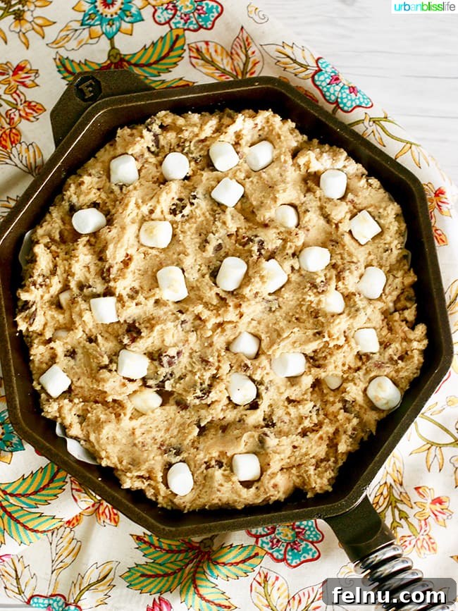 Chocolate Hazelnut Drizzled Smores Cookie Pie 4 Unbaked S'mores Pie in a cast iron skillet, ready for the oven