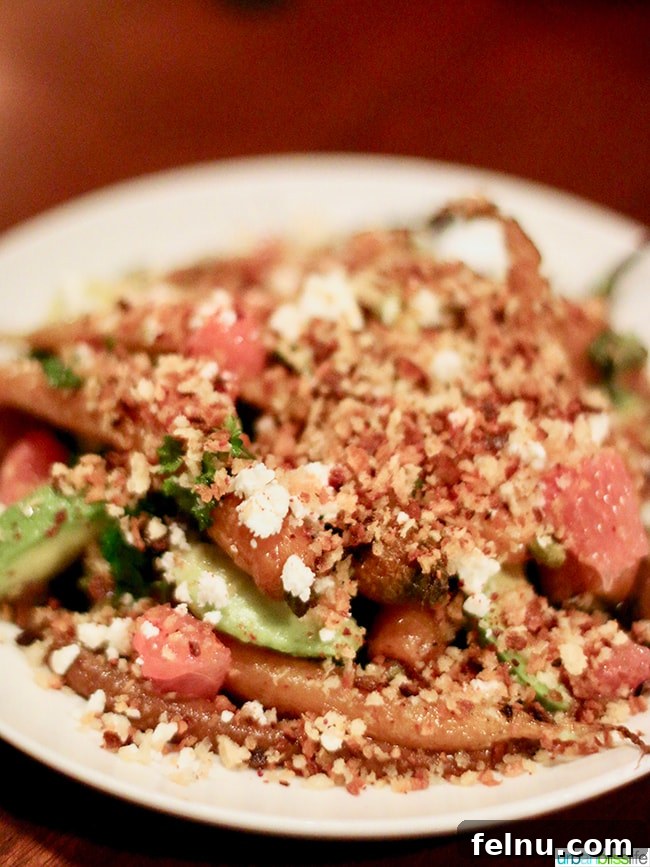 Carrots en Vinagreta, a vibrant salad at Bar Casa Vale with sunflower, black garlic, feta, avocado, and grapefruit.