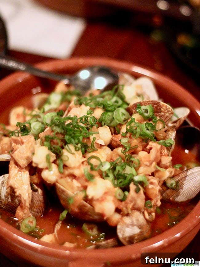 Steamed Clams with spicy tomato braised tripe and chickpeas at Bar Casa Vale.