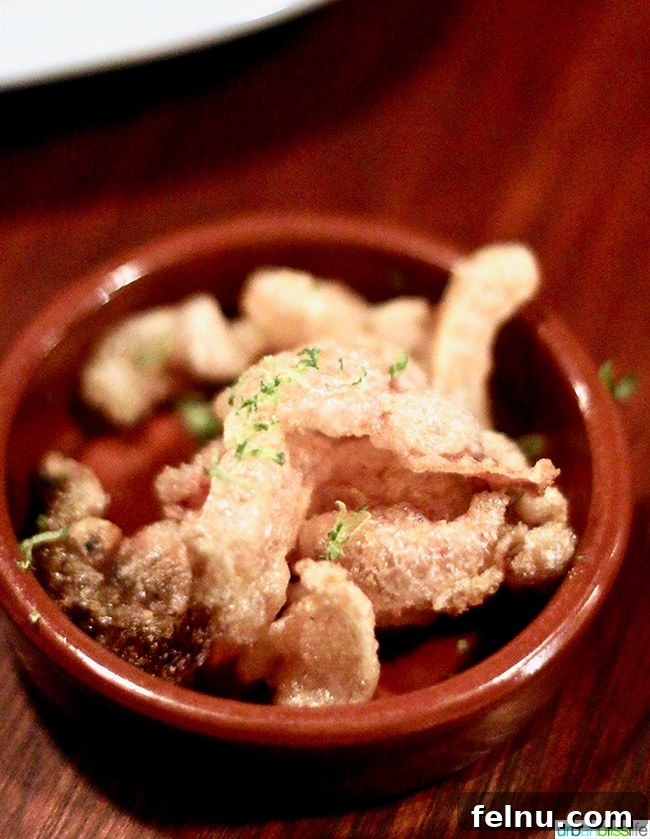 Crispy Chicharrones served with dried shrimp and lime at Bar Casa Vale.