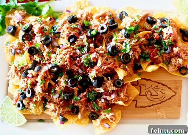 Fuel Your Fandom: Epic Game Day Eats & Drinks 5 BBQ Pulled Pork Nachos - Tips for Making Your Homegating Party a Touchdown! Ideas and Recipes on UrbanBlissLife.com.