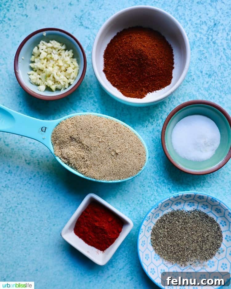 Fall-Off-The-Bone Instant Pot Ribs with Homemade BBQ 4 Ingredients for making homemade dry BBQ rub laid out on a surface.