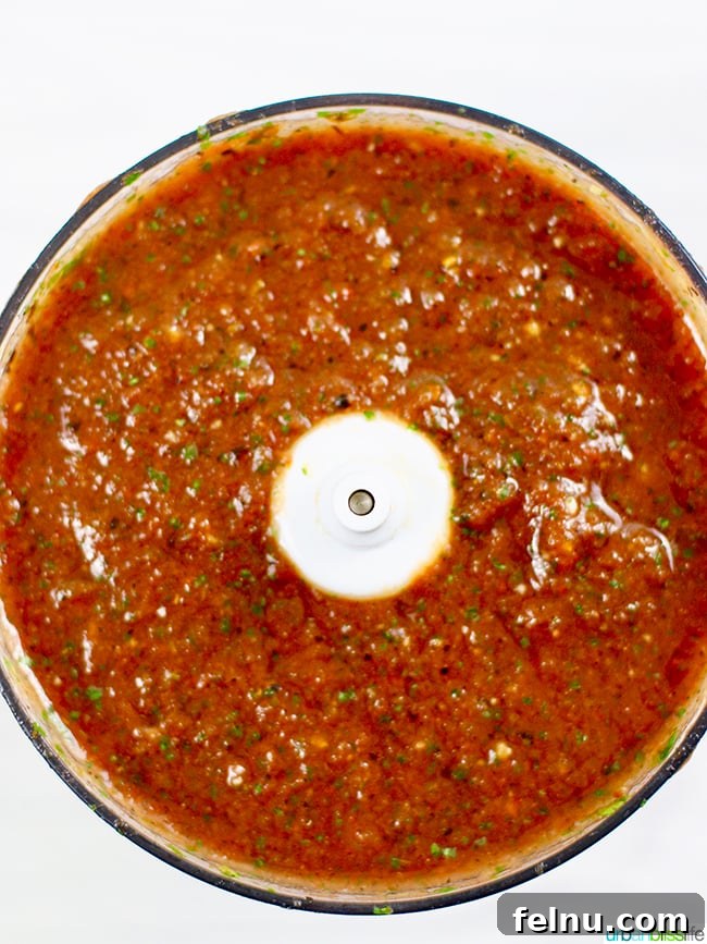 All ingredients for restaurant-style salsa in a food processor