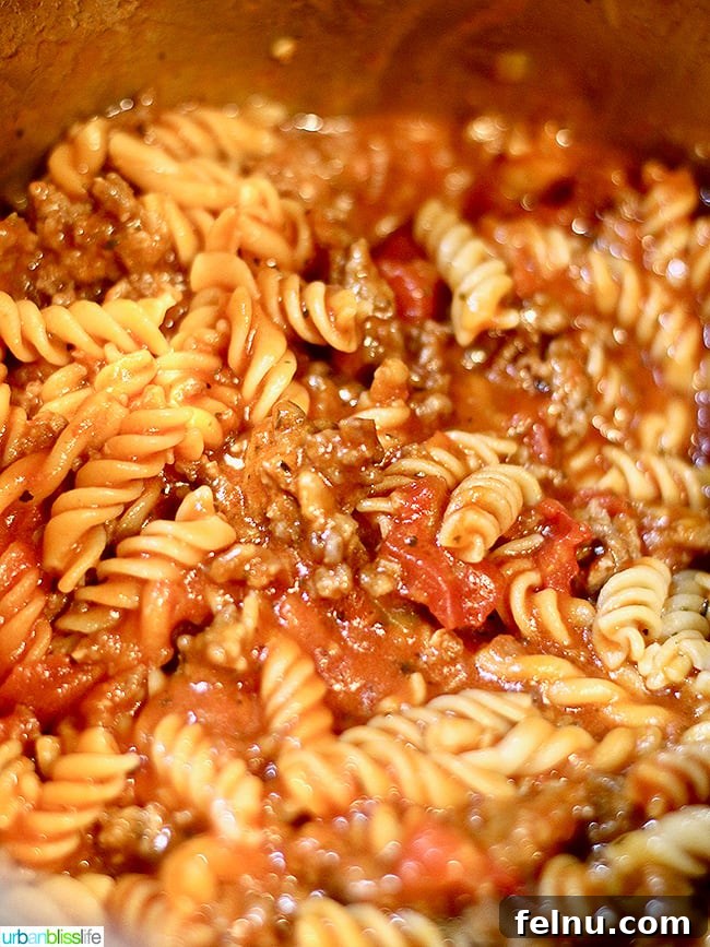 Easy Instant Pot Sausage and Peppers Pasta in 30 Minutes 4 Instant Pot Sausage Peppers & Pasta cooking
