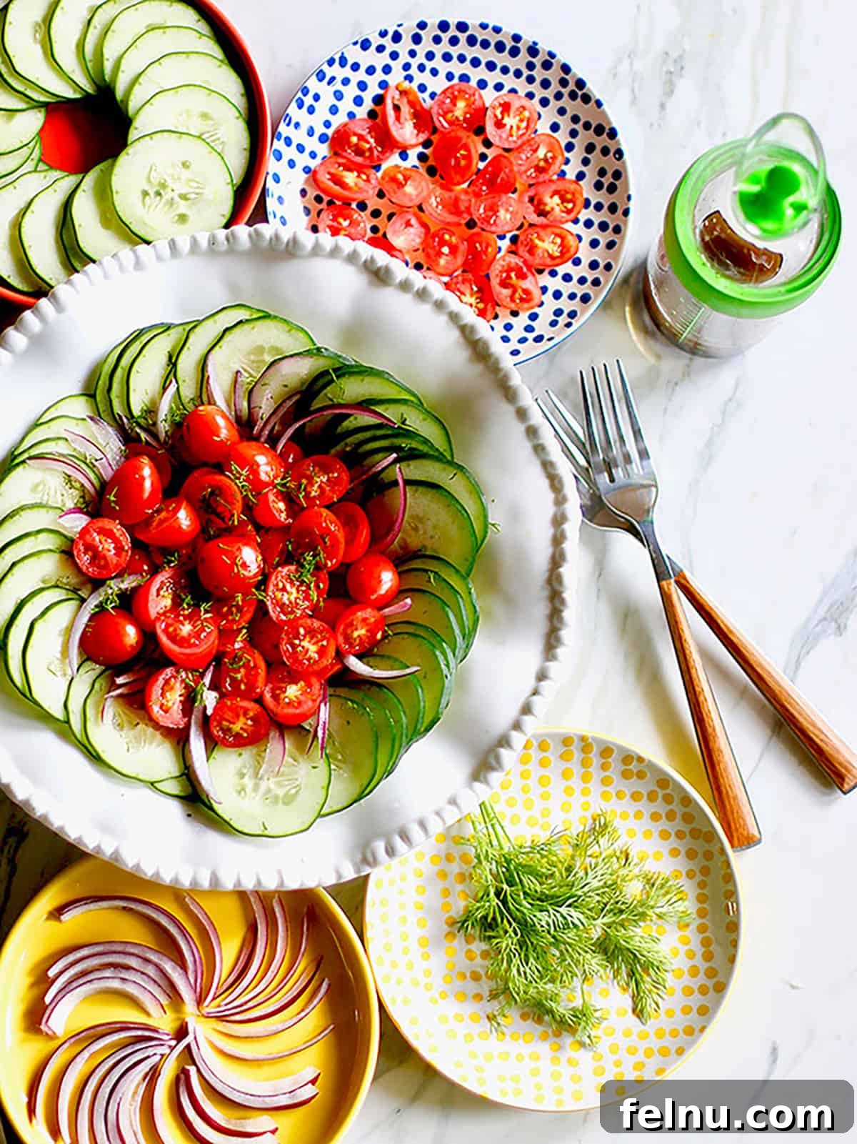 Mediterranean Cucumber and Tomato Medley 2 Mediterranean Cucumber Tomato Salad overhead with two forks