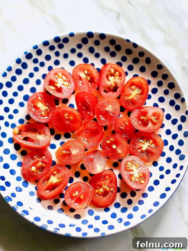 Mediterranean Cucumber and Tomato Medley 6 Halved cherry tomatoes on a plate