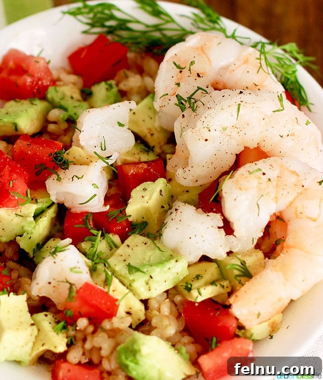 Close-up of succulent shrimp in a healthy avocado brown rice bowl