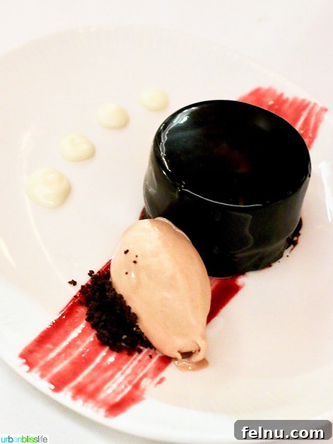 Rich Chocofont dessert with Madeira ganache, chocolate hazelnut praline, mousse, and sangria gastrique.