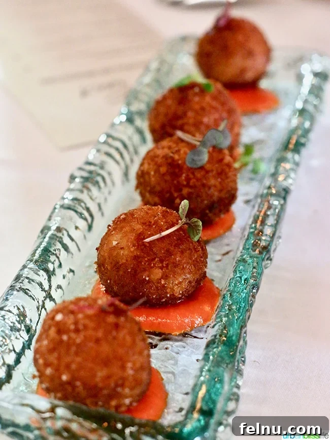 Crispy Croquetes de Pernil Ibèric, Spanish fritters with Iberico ham and Piquillo Sauce.